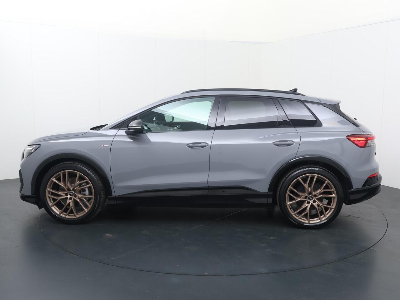 Audi Q4 e-tron 45 S Edition 82 kWh | 286 PK | SoH 100% | Adaptive cruise control | 21"LM velgen | Keyless | S line | Stoelverwarming |