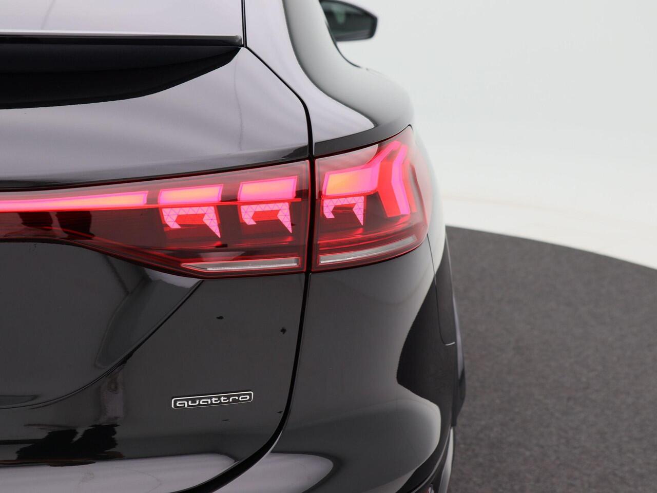 Audi Q6 Sportback S edition e-tron 55 100 kWh | 388 PK | 21 inch velgen | Privacyglas | Zwart optiek | Glazen Panoramadak | Rode remzadels |