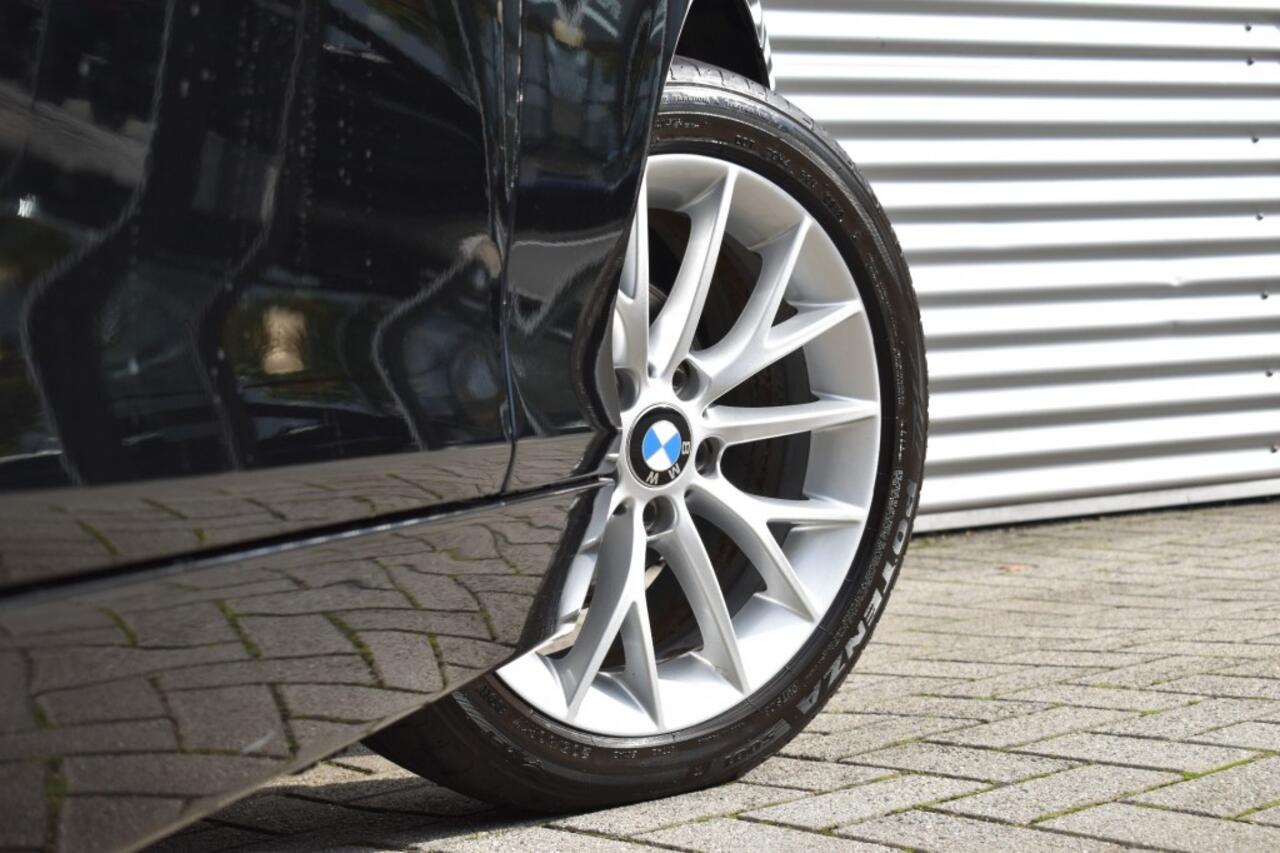 BMW 1-SERIE 116I SPORT LINE EDITION / NL AUTO / NAVI / PDC / SPORTSTOELEN