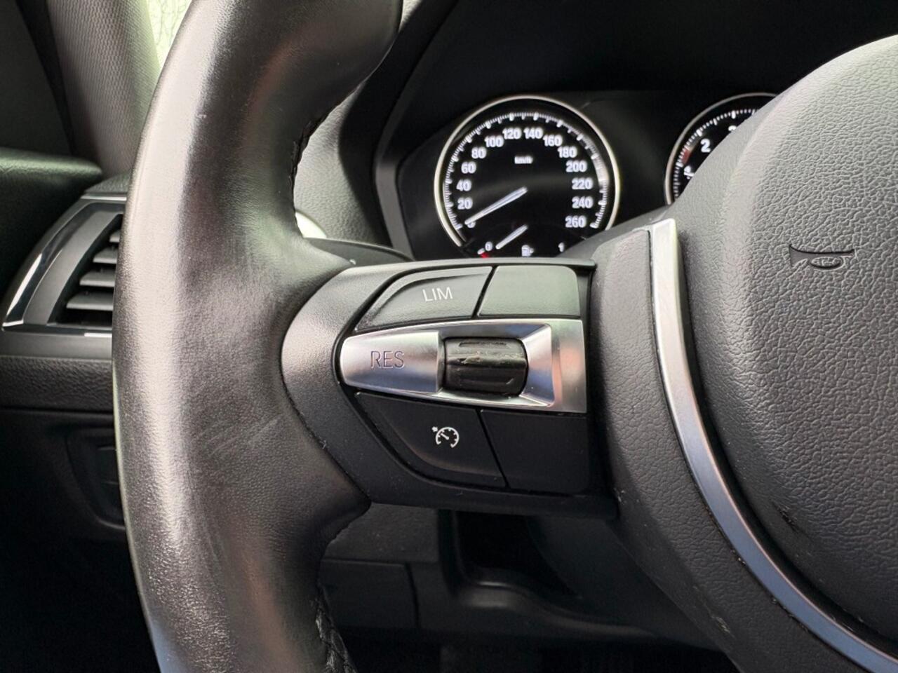 BMW 1-SERIE 118I EXECUTIVE AUT. NAVI AIRCO CRUISE STOELVERW