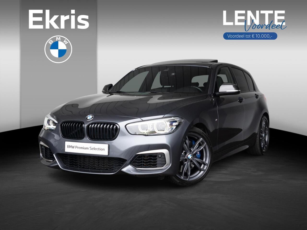 BMW 1-SERIE M140i | High Executive | Akrapovic | Harman-Kardon | Stuurwielrand verwarmd | Achteruitrijcamera | Schuif-/kanteldak | Stoelverwarming | Lentevoordeel