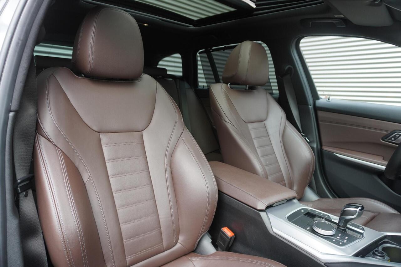 BMW 3-SERIE Touring 330i High Executive | Glazen panoramadak | Achteruitrijcamera | HiFi System | Elektrisch verwarmde voorstoelen