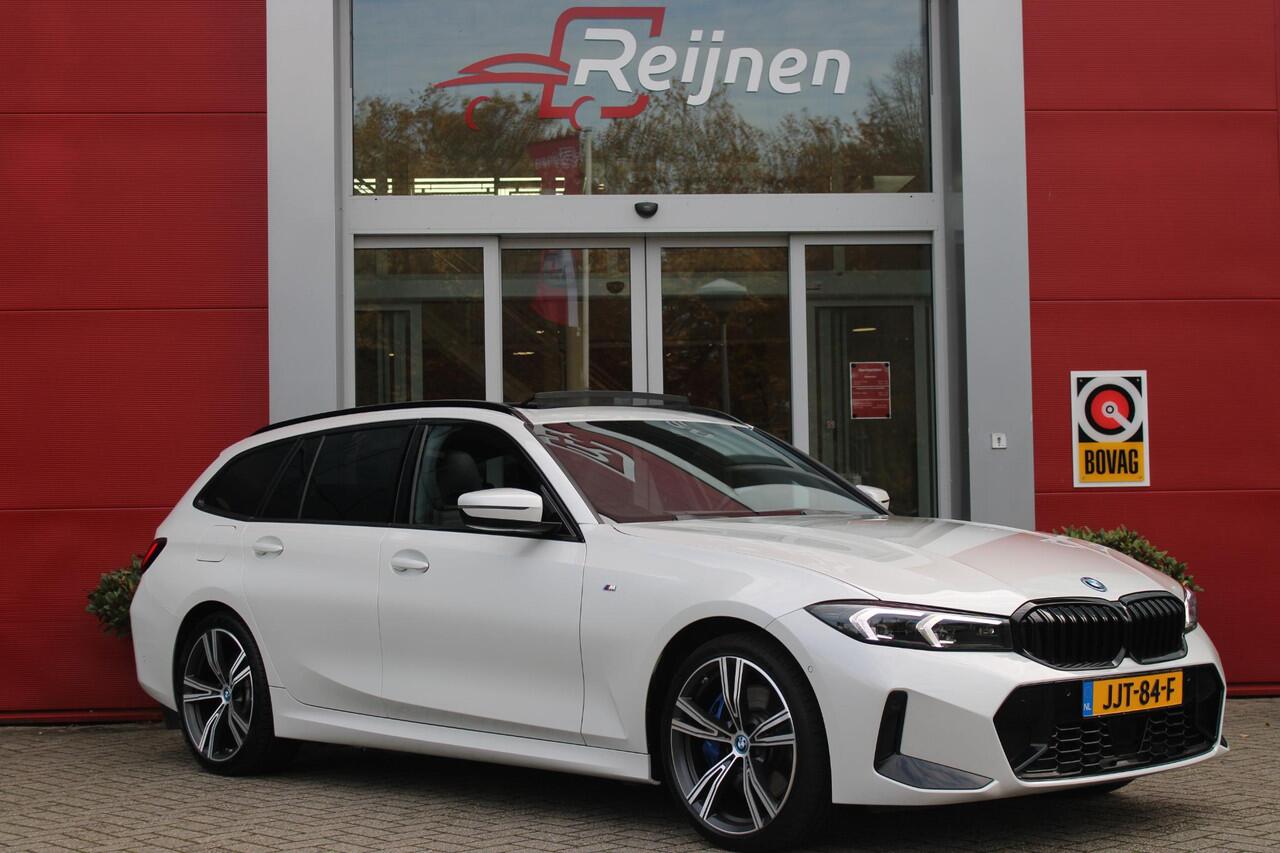 BMW 3-SERIE Touring 330e 292PK M-SPORT | M-SPORT PRO-PAKKET | M-SPORT REMMEN UITGEVOERD IN DONKERBLAUW MET M LOGO | BMW LIVE COCKPIT PROFESSIONAL | CURVED DISPLAY |DRIVING ASSISTANT INCL. HEAD-UP DISPLAY | PANORAMISCH SCHUIF/KANTEL DAK | PARKING ASSIST INCL. ACHTERUI