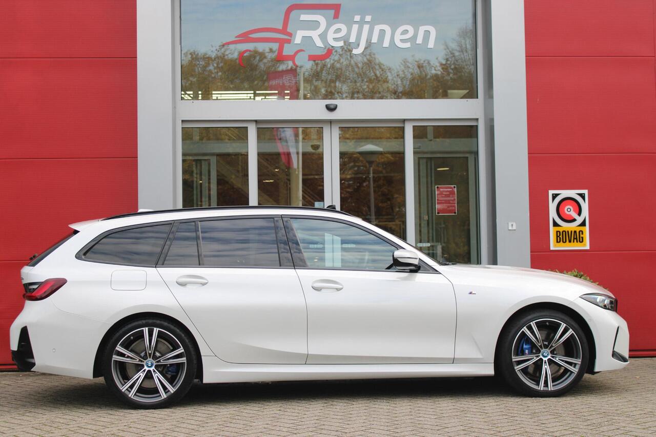 BMW 3-SERIE Touring 330e 292PK M-SPORT | PANORAMISCH SCHUIF/KANTEL DAK | M-SPORT PRO-PAKKET | M-SPORT REMMEN UITGEVOERD IN DONKERBLAUW MET M LOGO | BMW LIVE COCKPIT PROFESSIONAL | CURVED DISPLAY |DRIVING ASSISTANT INCL. HEAD-UP DISPLAY | PARKING ASSIST INCL. ACHTERUI