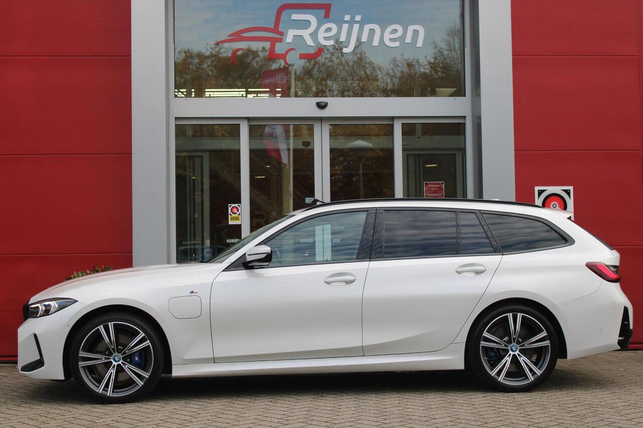 BMW 3-SERIE Touring 330e 292PK M-SPORT | PANORAMISCH SCHUIF/KANTEL DAK | M-SPORT PRO-PAKKET | M-SPORT REMMEN UITGEVOERD IN DONKERBLAUW MET M LOGO | BMW LIVE COCKPIT PROFESSIONAL | CURVED DISPLAY |DRIVING ASSISTANT INCL. HEAD-UP DISPLAY | PARKING ASSIST INCL. ACHTERUI