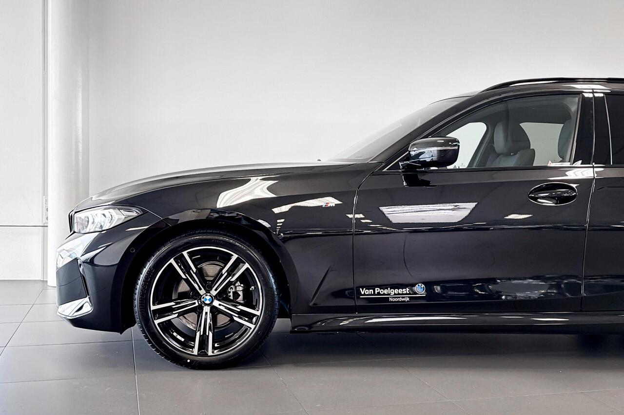 BMW 3-SERIE Touring 318i | M Sport | Glazen Panoramadak | Stoelverwarming | Achteruitrijcamera |