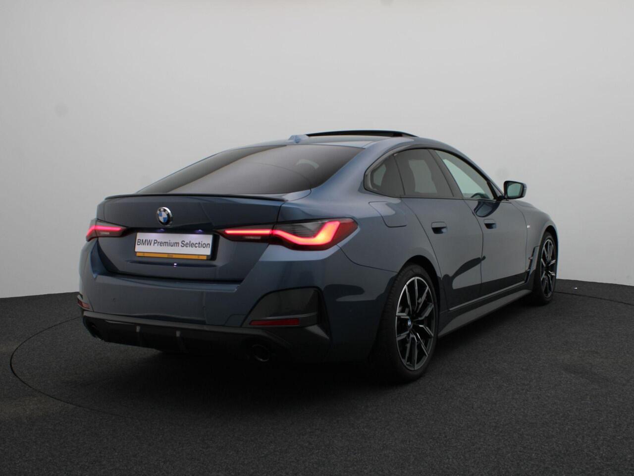 BMW 4-SERIE Gran Coupé 420i High Executive | M Sportpakket Pro | Achteruitrijcamera | Schuifdak | Extra Getint Glas Achter | Parking Assistant | DAB | HiFi | 19''