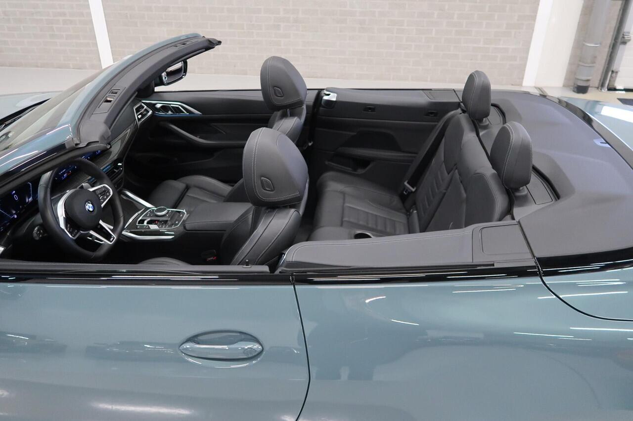 BMW 4-SERIE Cabrio 420i High Executive M-Sport Sportstoelen Camera Stoelverwarming Curved dashboard Navigatie Airco-ecc 19 inch Sportvelgen App connect Cape York Green metallic Zwart sportleer