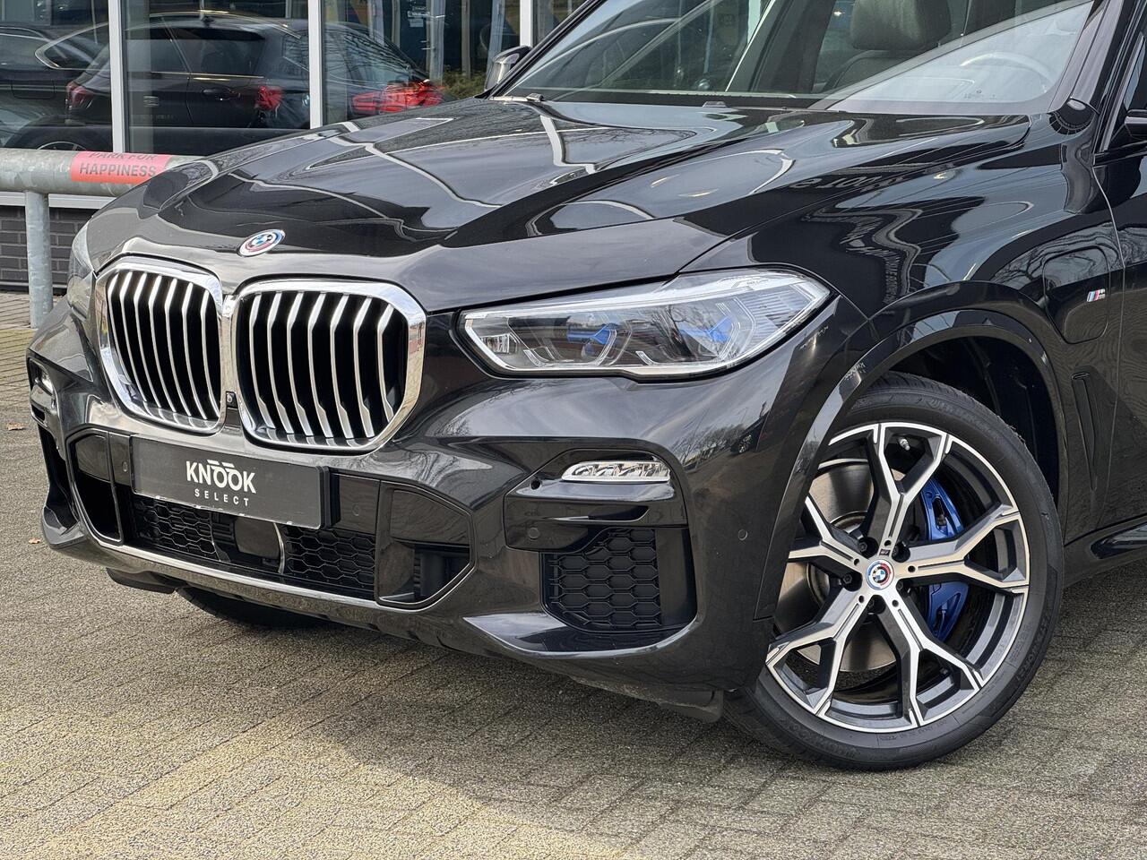 BMW X5 xDrive45e High Executive M Sport Pakket Automaat / Panoramadak / Active Steering / Trekhaak / Head-Up Display / Comfortstoelen / Laserlight / Driving Assistant Professional / 21 Inch / Luchtvering / Hifi / Craftedclarity / Shadow Line / M Sportremsysteem