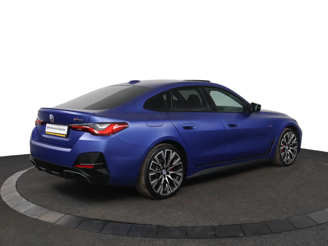 BMW i4 M50 High Executive 84 kWh | Schuif-/kanteldak | Adaptief M Onderstel | Comfort Access | Driving Assistant Professional | Stuur- en stoelverwarming | Laserlight | Carbon Interieur |