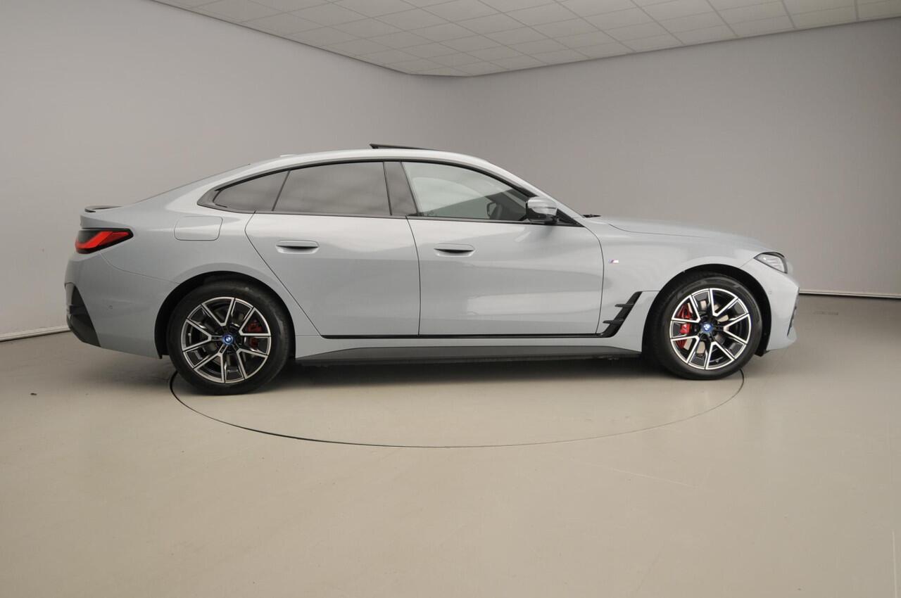 BMW i4 Gran Coupé eDrive35 M-Sportpakket | LED | Leder | HUD | Schuifdak | Active cruise | Sportstoelen | DAB | Hifi speakers | Alu 18 inch