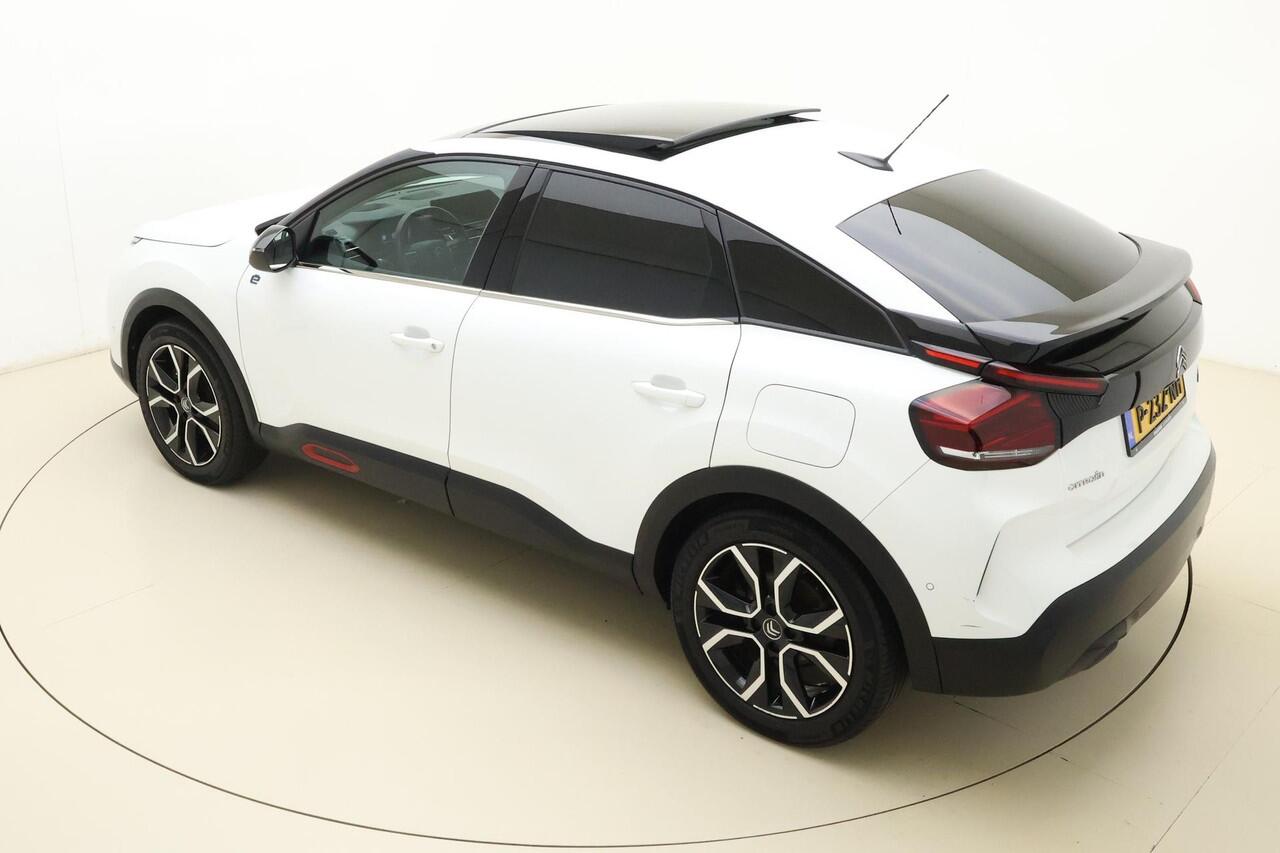 Citroen ë-C4 Shine 50 kWh SOH 91,44% | Panoramisch schuif/kanteldak | Navigatie | Lederen bekleding | Stoelverwarming | Camera | Keyless | Climate control | Verwarmd voorruit