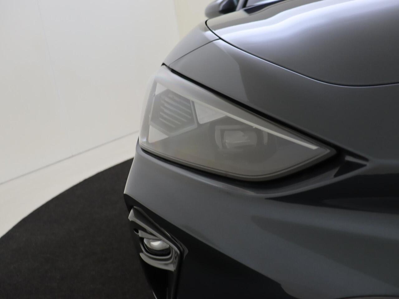 Cupra Leon Sportstourer 1.5 TSI e-Hybrid Business | Achteruitrijcamera | 3-zone airco | CarPlay | Keyless | Sfeerverlichting | Stuurwiel verwarmd | Voorklimatisering |