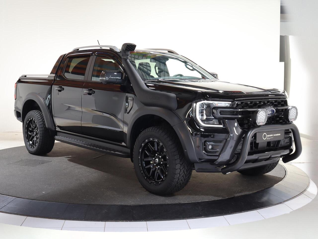 Ford RANGER WILDTRAK | DAKAR EDITITON | 2.3 PHEV | 279 PK | 5-ZITS | 20" TOMASON LICHTMETAAL | ARB LED LIGHTS | 360 CAMERA | 3500 KG TREKHAAK AFNEEMBAAR | ADAPTIVE CRUISE | BLIND-SPOT | STOELVERWARMING | LEDER | LED | PLUG IN HYBRIDE | METALLIC
