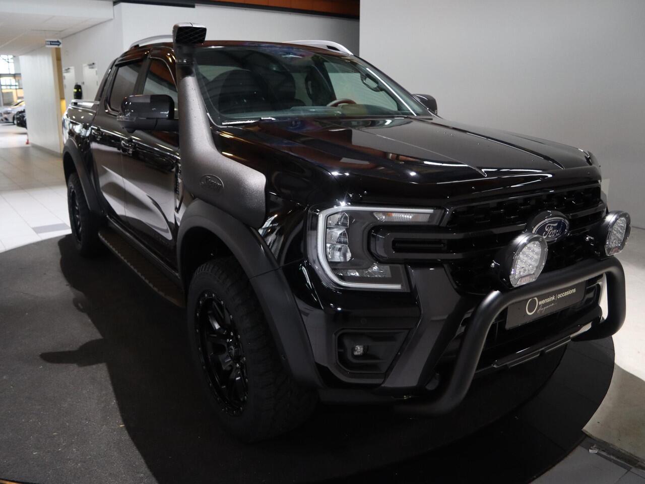 Ford RANGER WILDTRAK | DAKAR EDITITON | 2.3 PHEV | 279 PK | 5-ZITS | 20" TOMASON LICHTMETAAL | ARB LED LIGHTS | 360 CAMERA | 3500 KG TREKHAAK AFNEEMBAAR | ADAPTIVE CRUISE | BLIND-SPOT | STOELVERWARMING | LEDER | LED | PLUG IN HYBRIDE | METALLIC
