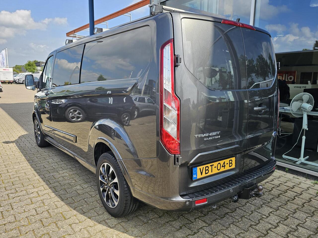 Ford TRANSIT CUSTOM 320 2.0 TDCI L2H1 Sport 185 pk Automaat | Cruise control | Navigatie | Lane assist | Half leder | Stoelverwarming | Airco | Trekhaak | Zéér compleet!