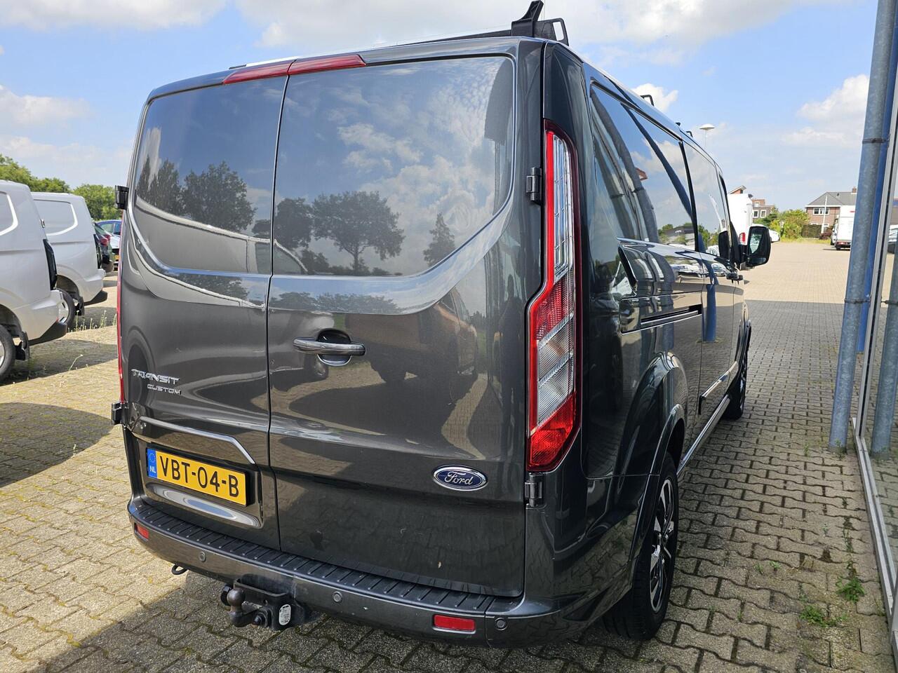 Ford TRANSIT CUSTOM 320 2.0 TDCI L2H1 Sport 185 pk Automaat | Cruise control | Navigatie | Lane assist | Half leder | Stoelverwarming | Airco | Trekhaak | Zéér compleet!