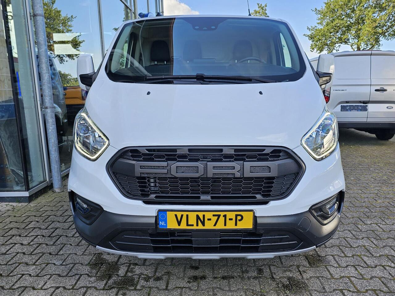 Ford TRANSIT CUSTOM 300 2.0 TDCI L2H1 Trail | Glasslook panelen | Raptor grille | Camera | Trekhaak | Leder | Voorruitverwarming | Airco | Cruise control etc.