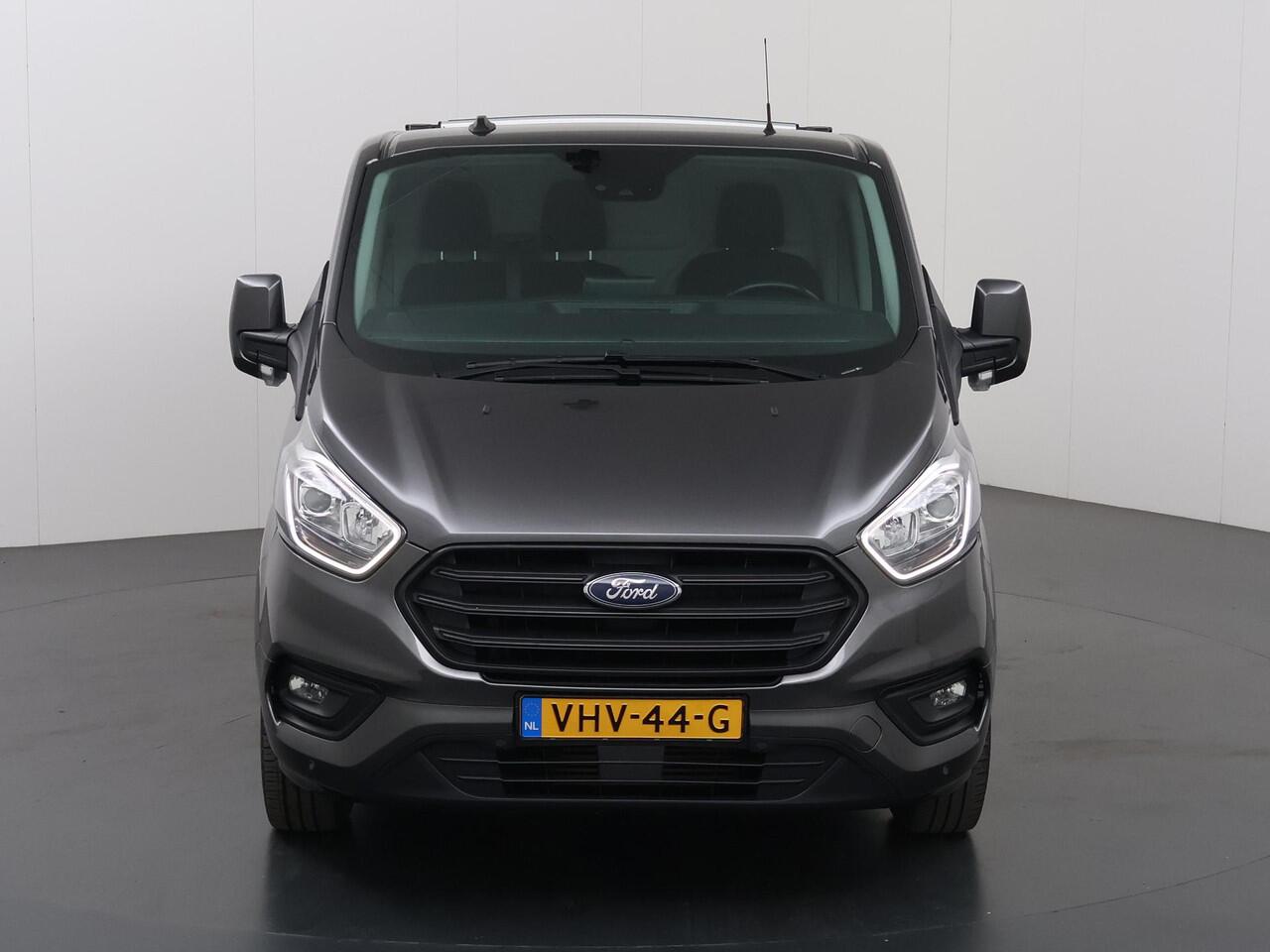 Ford TRANSIT CUSTOM 340 2.0 TDCI | L1 H1 | TREND | ACHTERUITRIJCAMERA | PARKEERSENSOREN | 3-ZITS | METALLIC | TREKHAAK | BETIMMERDE LAADRUIMTE | VOORRUITVERWARMING | CRUISE CONTROL | DAK DRAGERS