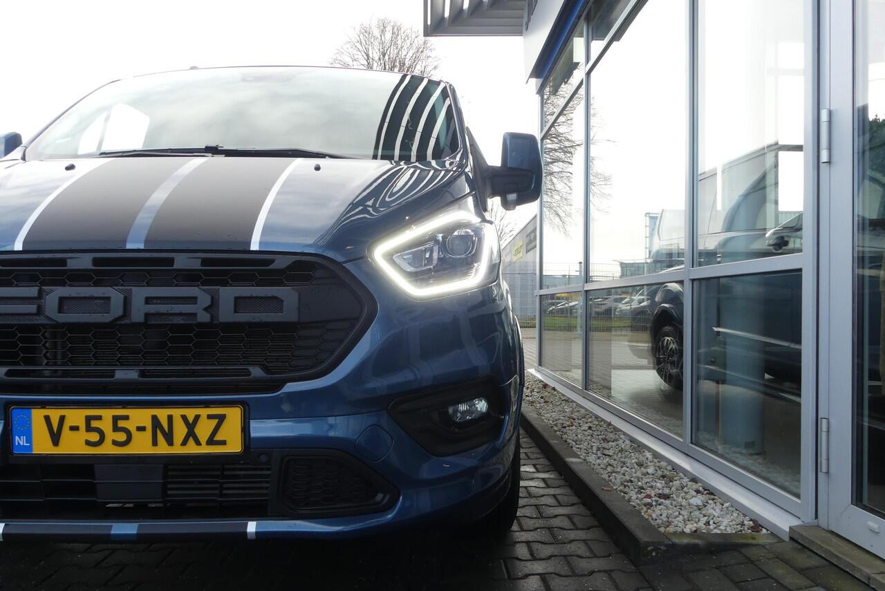 Ford TRANSIT CUSTOM 320 2.0 TDCI L2H1 Sport 5p., TREKHAAK (2.550KG), DUBBELE SCHUIFDEUR, WINTER PACK, CRUISE, AIRCO, CAMERA, PDC V&A, APPLE CARPLAY/ANDROID AUTO, BI-XENON, LANE ASSIST, DAB, 47.576KM