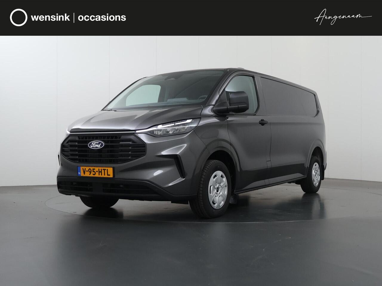 Ford TRANSIT CUSTOM 320 | 2.0 TDCI | L2 H1 | TREND | BPM VRIJ! | CAMERA | CRUISE CONTROL | CLIMATE CONTROL | CARPLAY ANDROID AUTO | 2800 KG AHW MOGELIJK | COMFORT BESTUURDERSTOEL | ACHTERKLEP | STOELVERWARMING