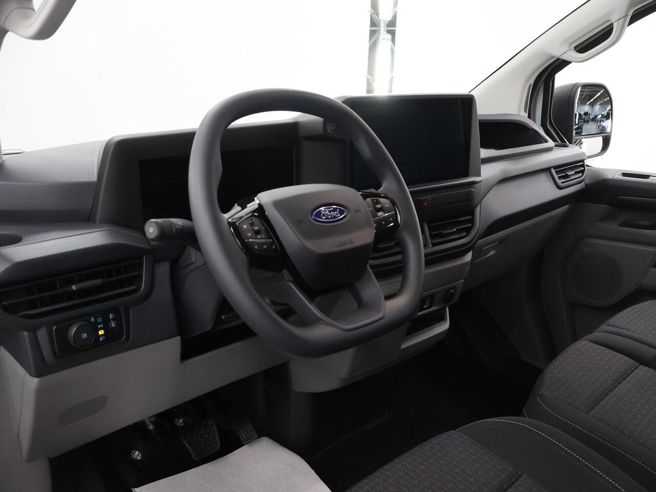 Ford TRANSIT CUSTOM E-Transit 320 | L1 H1 | TREND | 65 kWh | 328 KM RANGE | CLIMATE CONTROL | CARPLAY / ANDROID AUTO | STOELVERWARMING | SPIEGEL VERWARMING | ACHTERUITRIJCAMERA | VOORRUITVERWARMING | LAADRUIMTE PAKKET | VOORBEREIDING 2300 KG TREKHAAK