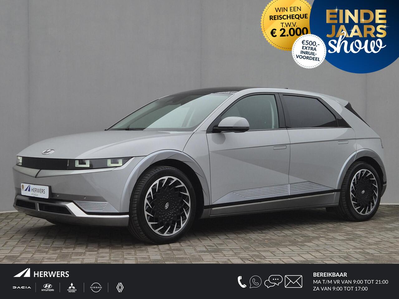 Hyundai IONIQ 5 Lounge 73kWh Automaat / Accu SOH 100% / Fabrieksgarantie tot 10-2026 / Dealer onderhouden / Panoramadak / WLTP 451 km / Afn. trekhaak 1.600 kg / Elektrische klep en stoelen / Stuur-, stoel- en achterbankverwarming /