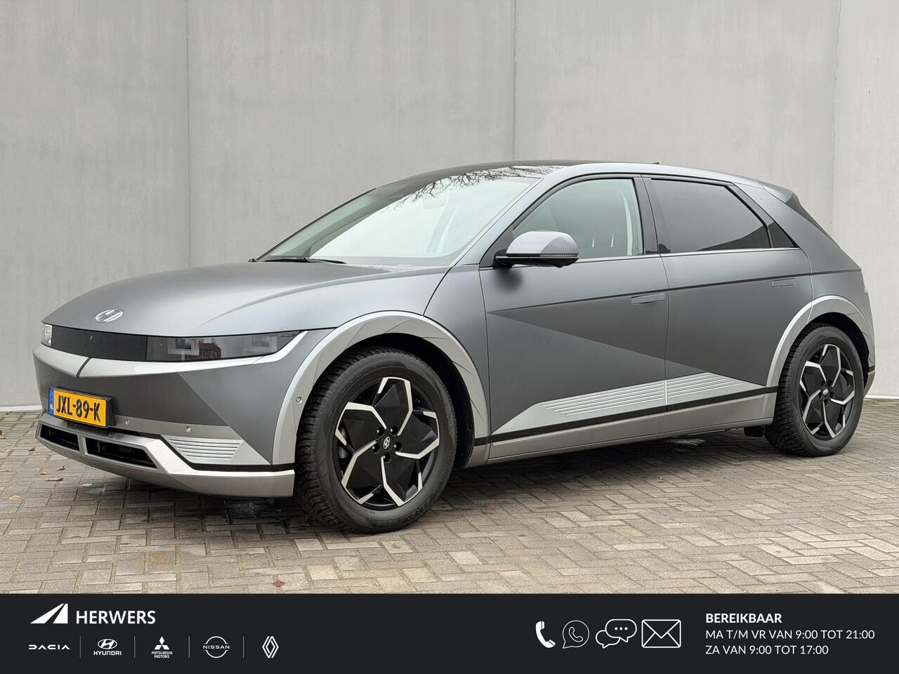 Hyundai IONIQ 5 Lounge 73kWh Automaat SOH 100% / Panoramadak / Dealer onderhouden / Fabrieksgarantie tot 12-2026 / 8 Jaar Batterij Garantie / All Season banden / Warmtepomp / HUD / 360 Camera / Navigatie / Elektr. stoelen + Memory / Stoel & Stuurwiel Verwarming / Stoe