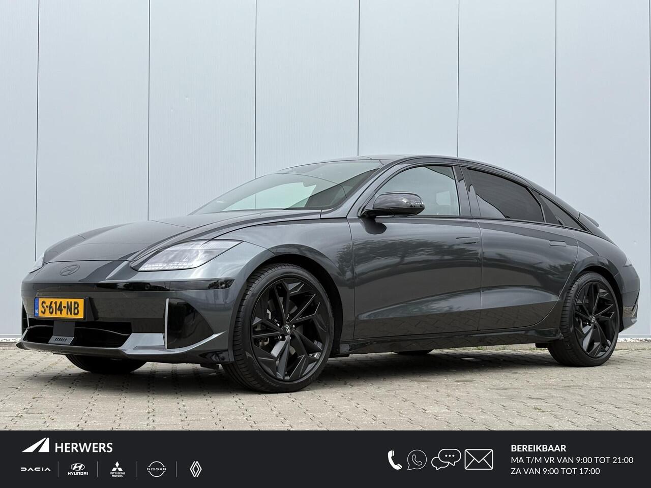 Hyundai IONIQ 6 First Edition AWD 77.4 kWh / SoH 100% / Warmtepomp / V2L / Schuif-kanteldak / 360 Camera / HUD Dsiplay / Automatische Flush handgrepen / Airco / Stoel verwarming / Stuurverwarming / Full Option /