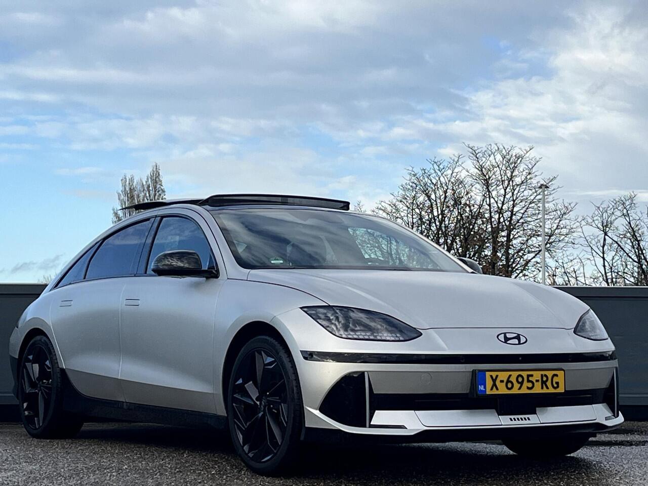Hyundai IONIQ 6 First Edition AWD 77.4kWh 325pk | SCHUIF/KANTELDAK | 800V SNELLADEN | 20? LICHTMETALEN VELGEN & MATZWARTE DESIGNACCENTEN | BOSE PREMIUM AUDIO | PREMIUM INTERIEUR |