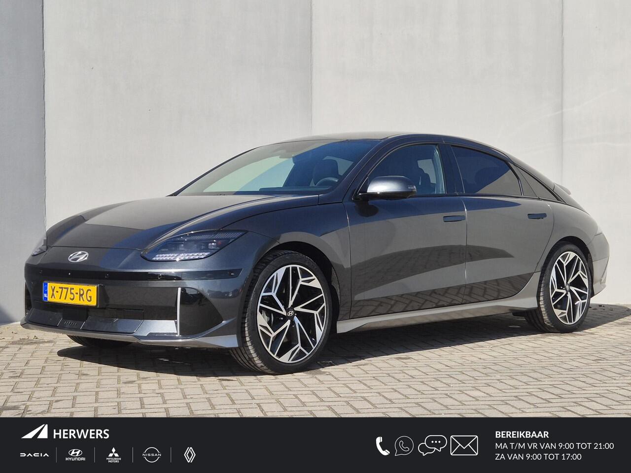 Hyundai IONIQ 6 Lounge AWD 77.4 kWh 325pk / SOH 100% / Fabrieksgarantie tot 03-2029 / Trekgewicht 1.500 kg / warmtepomp / CCS snellader / Rondomzicht camera / Head Up Display / Bose Audio Systeem / Stuur- en Stoelverwarming / Elektrische achterklep / Adaptief cruise co