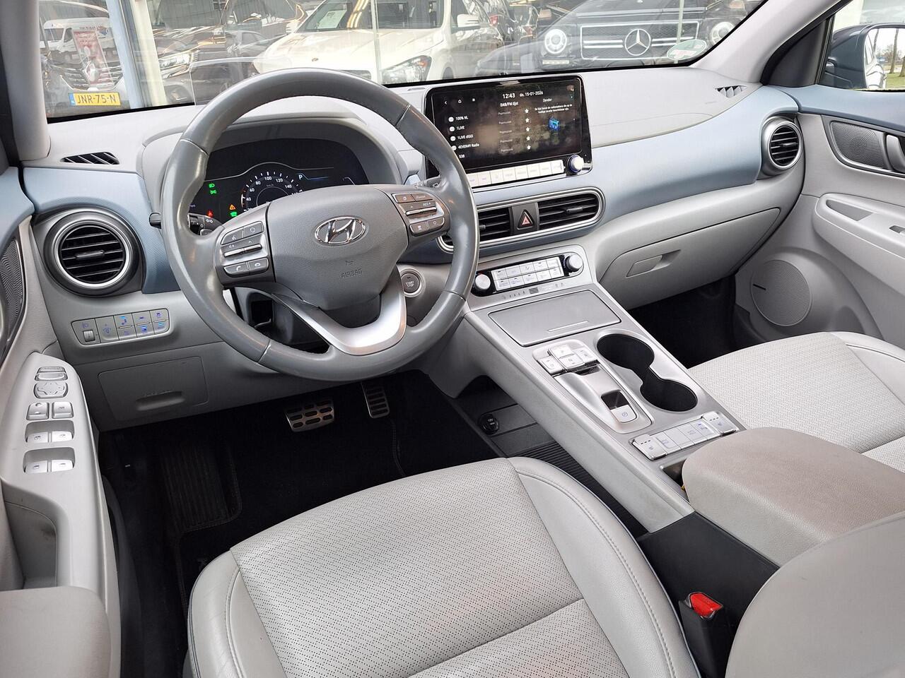 Hyundai Kona EV Premium 64 kWh | SOH: 94,6% | Leder | Warmtepomp | Adaptive CC | Navi | Camera |
