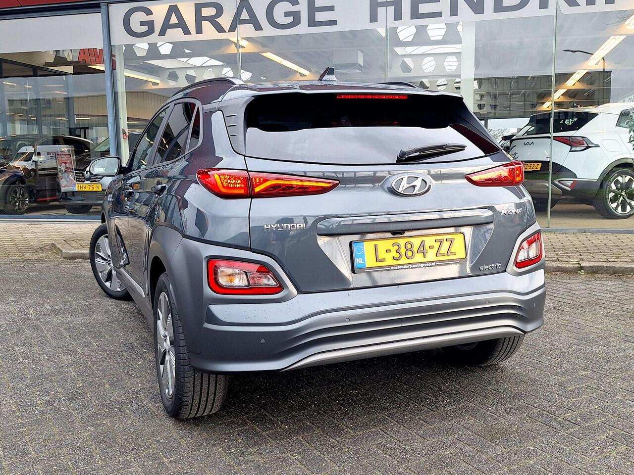 Hyundai Kona EV Premium 64 kWh | SOH: 94,6% | Leder | Warmtepomp | Adaptive CC | Navi | Camera |