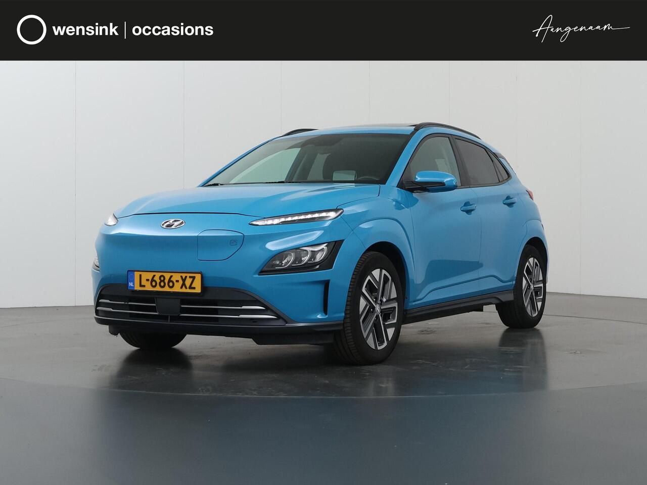 Hyundai Kona EV Limited Sky 64 kWh | SOH 93,2% | Nieuw Model! | Panoramadak | HUD | Parkeercamera | Cruise Control Adaptief | Stoelverwarming/ventilatie | Krell Audio | Keyless Entry/Go | Apple Carplay/Android Auto |