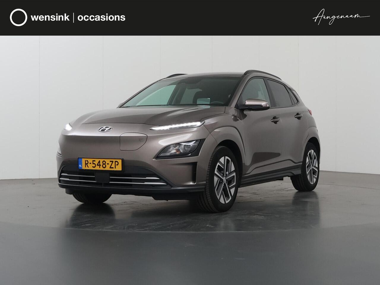Hyundai Kona EV Fashion 39 kWh | SOH 98% | Cruise Control Adaptief | LED | Parkeercamera | DAB | Keyless Entry/Go | HUD | Warmtepomp | Dodehoekdetectie | Apple Carplay/Android Auto |