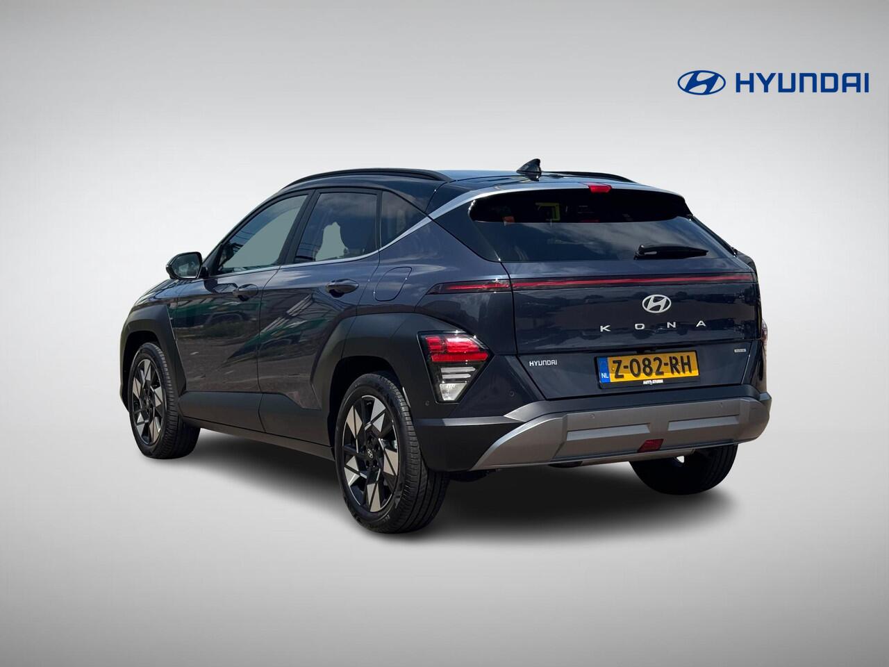 Hyundai Kona 1.6 GDI HEV Premium | Two-Tone Lakkleur | Stoelverwarming + -Ventilatie | 360° Camera | Leder | Navigatie | Apple Carplay/Android Auto | Geheugenstoel | Rijklaarprijs!