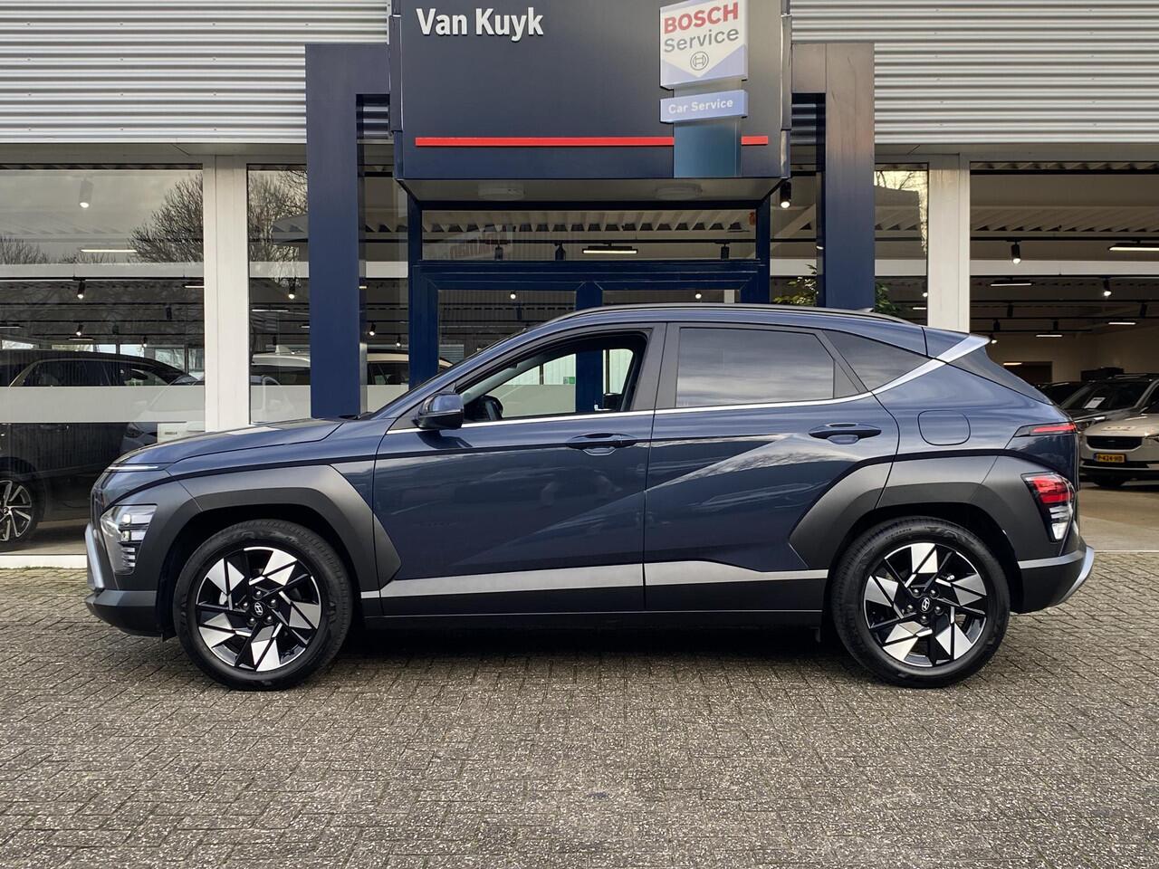 Hyundai Kona 1.6 GDI HEV Comfort Smart / Automaat / NL-Auto / 1e-Eigenaar / 18.000 Km / Fabrieksgarantie / Keyless / Digitaal Dashboard / LED / DAB / Apple-Carplay&Android-Auto / Navi / Camera / Stuur+Stoelverwarming / Adaptieve Cruise-Control / Lane-Assist / E-Achter