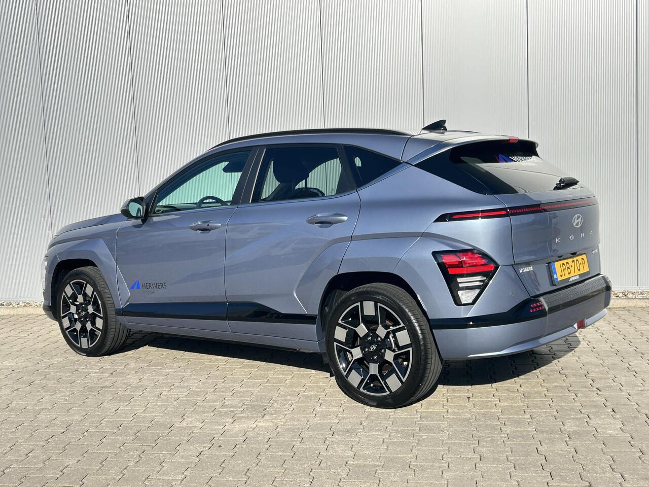 Hyundai Kona Electric Comfort Smart 65.4 kWh / Navigatie / Cruise Control Adaptief / Climate Control / Achterklep Elektrisch / Stoel & Stuurwiel Verwarming Voorzijde /