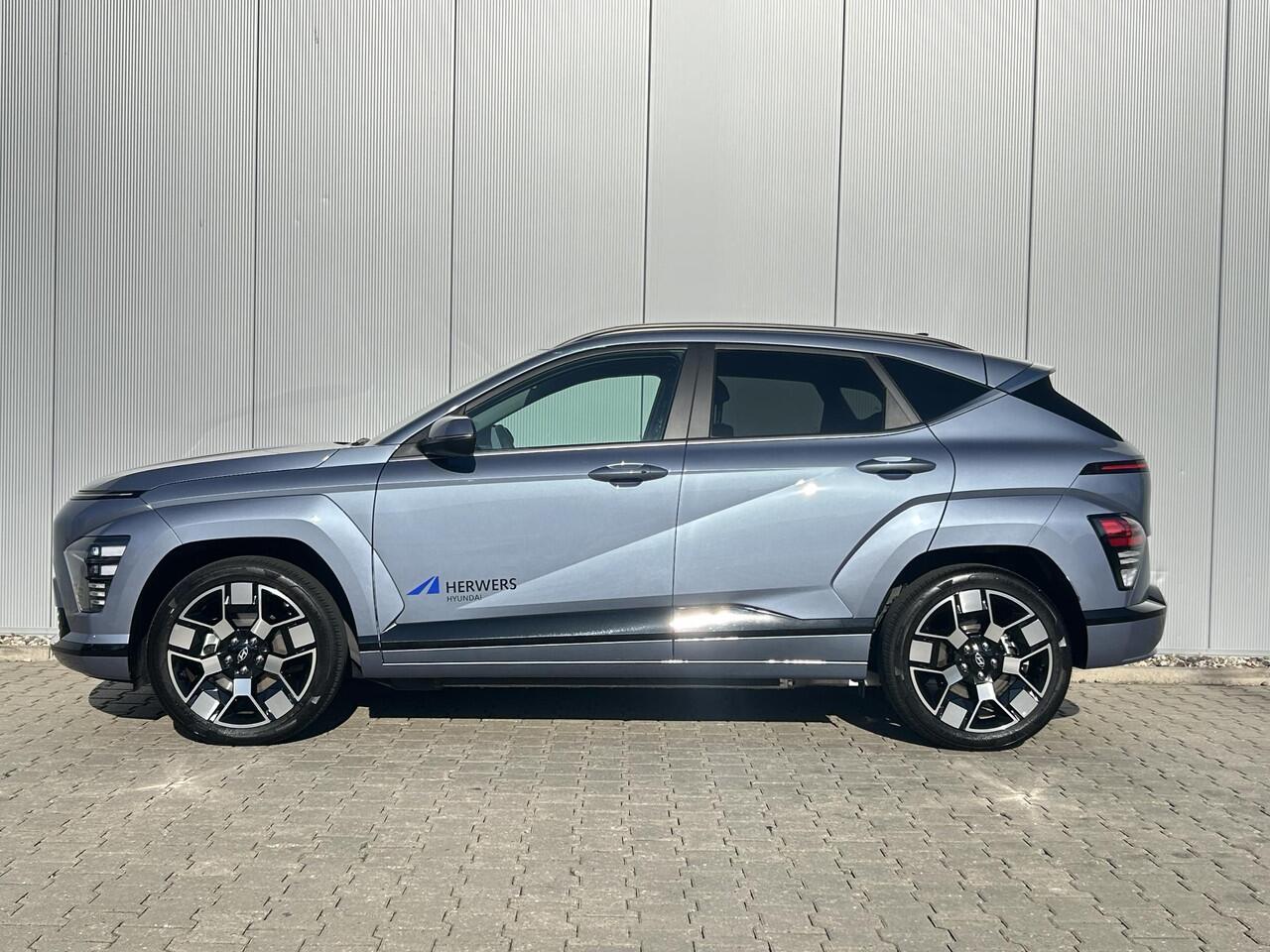 Hyundai Kona Electric Comfort Smart 65.4 kWh / Navigatie / Cruise Control Adaptief / Climate Control / Achterklep Elektrisch / Stoel & Stuurwiel Verwarming Voorzijde /