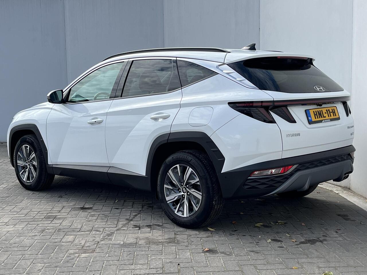 Hyundai TUCSON 1.6 T-GDI HEV 230 PK Premium / Duurste uitvoering / Trekgewicht 1650 kg / Apple Carplay Android Auto / Stuur- en Stoelverwarming / Rondomzicht camera / Climate Control / Stoelventilatie voor /