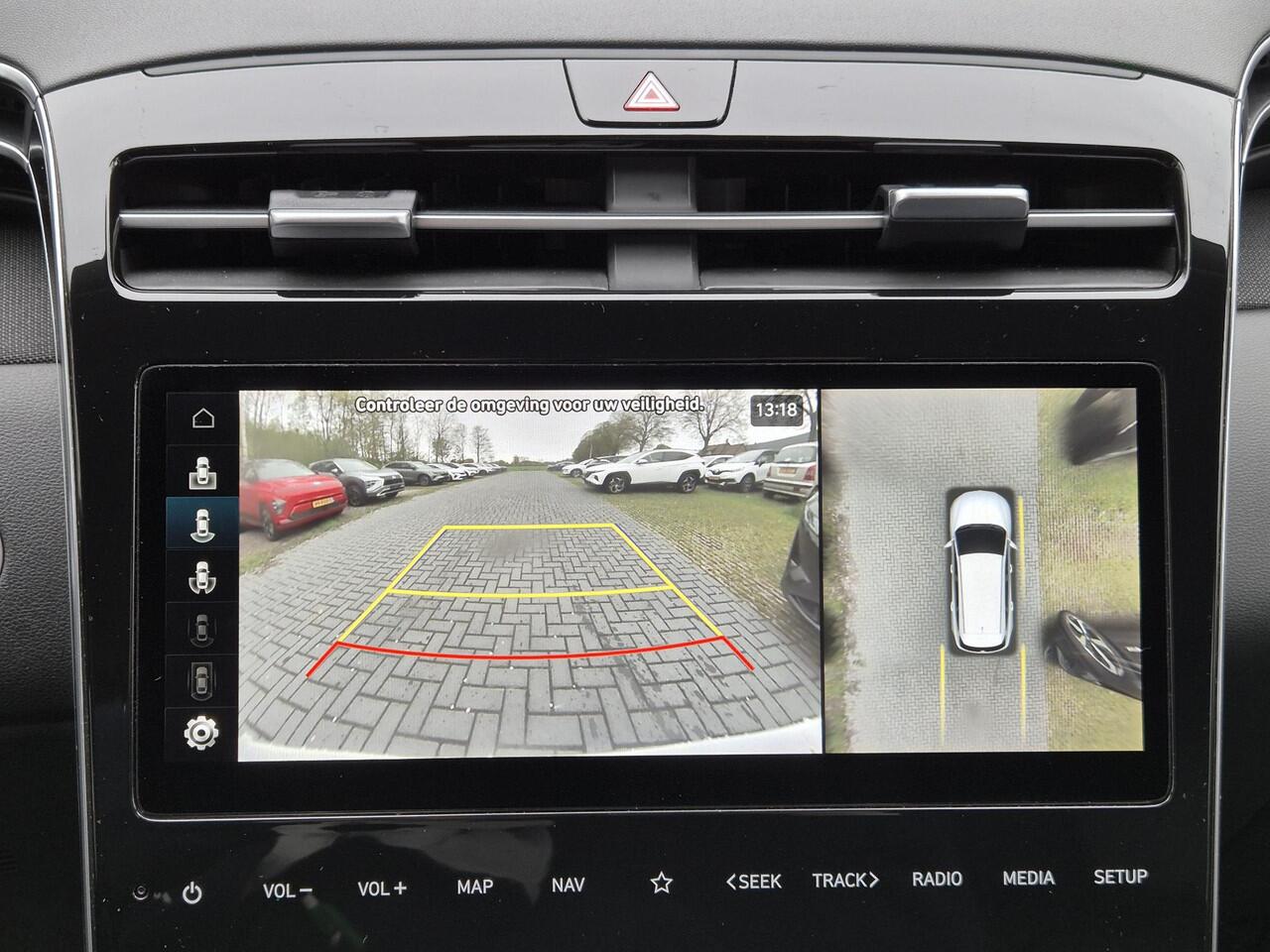 Hyundai TUCSON 1.6 T-GDI HEV 230 PK Premium / Duurste uitvoering / Trekgewicht 1650 kg / Apple Carplay Android Auto / Stuur- en Stoelverwarming / Rondomzicht camera / Climate Control / Stoelventilatie voor /