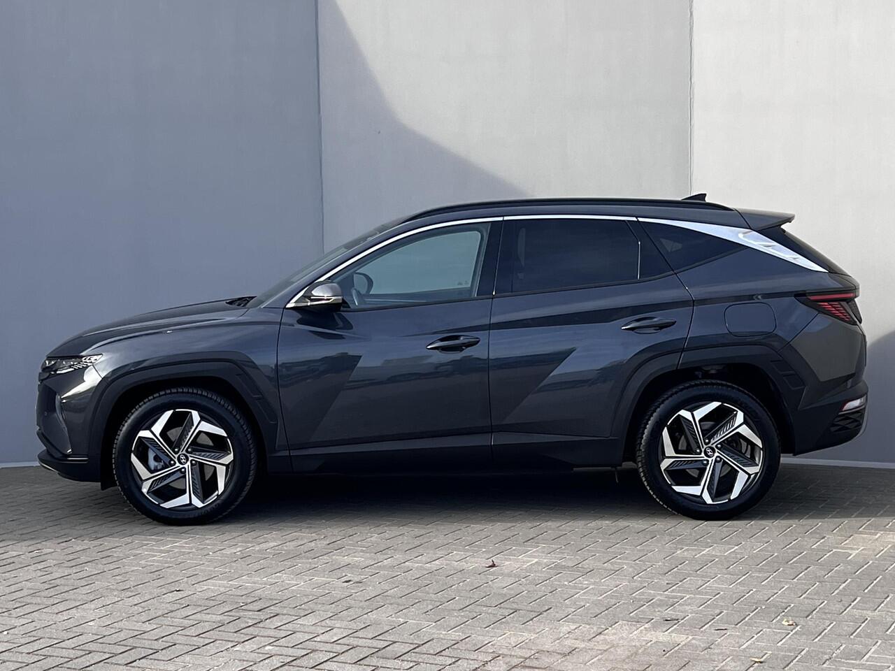 Hyundai TUCSON 1.6 T-GDI HEV Comfort Smart Automaat / Fabrieksgarantie tot 02-2028 ** / Dealer onderhouden / Navigatie / Achteruitrijcamera / Stuur- en stoelverwarming / Apple Carplay Android / 19" LM + All Season banden /