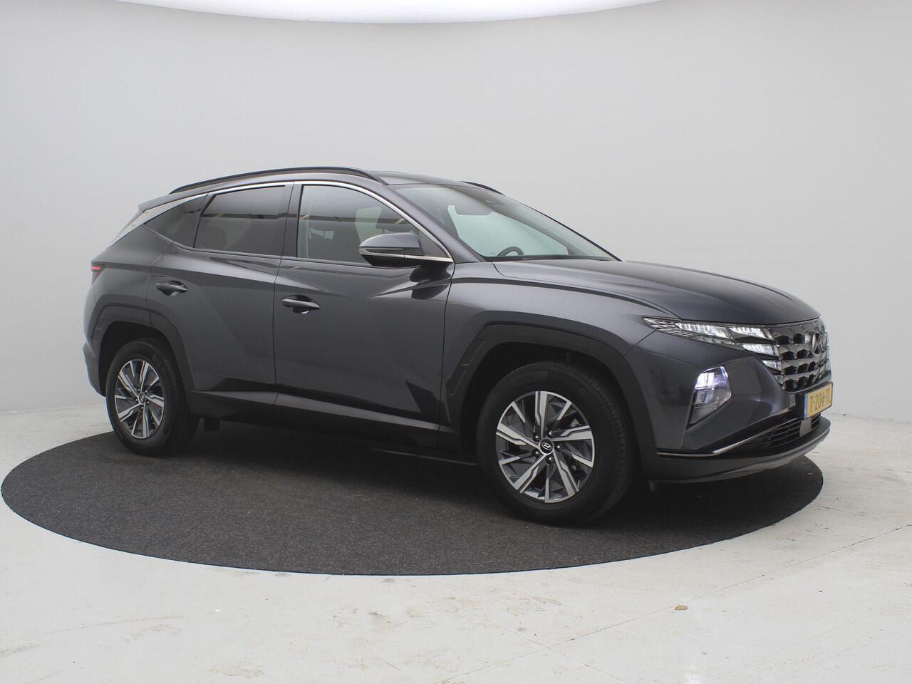 Hyundai TUCSON 1.6 T-GDI HEV Comfort AUTOMAAT / Navigatie / NL Auto / Apple CarPlay & Android Auto / 1650KG Trekgewicht / Achteruitrijcamera / 1ste Eigenaar / Climate control / Adaptieve Cruise control / Stoelverwarming / Dealeronderhouden /