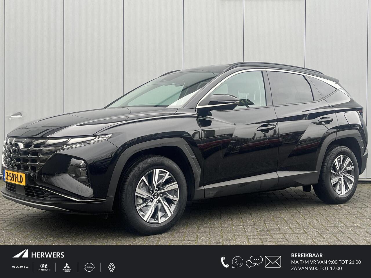 Hyundai TUCSON 1.6 T-GDI HEV Comfort Smart / 1650 kg trekvermogen / Elektrische Achterklep / Navigatie / Stoel & Stuurverwarming / Android Auto & Apple CarPlay / Adaptieve Cruise Control / Achteruitrijcamera / Parkeersensoren Voor + Achter / Passagiersstoel In Hoogte Ve