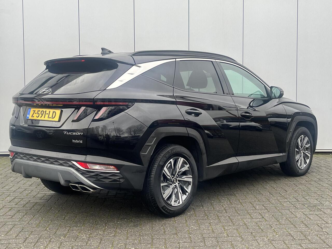 Hyundai TUCSON 1.6 T-GDI HEV Comfort Smart / 1650 kg trekvermogen / Elektrische Achterklep / Navigatie / Stoel & Stuurverwarming / Android Auto & Apple CarPlay / Adaptieve Cruise Control / Achteruitrijcamera / Parkeersensoren Voor + Achter / Passagiersstoel In Hoogte Ve