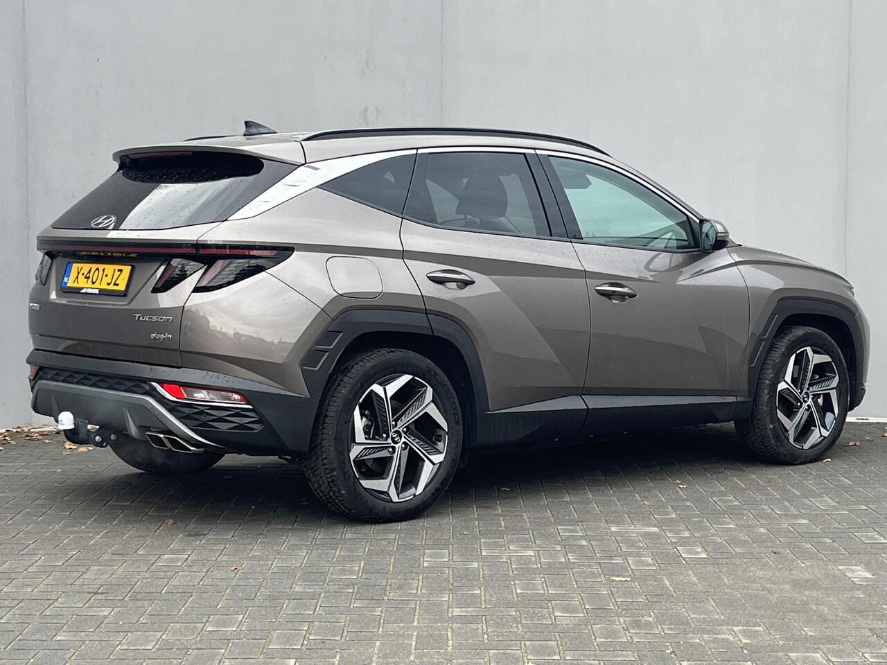 Hyundai TUCSON 1.6 T-GDI PHEV Comfort Smart 4WD / Vaste Trekhaak 13-polig (Trekgewicht 1.350kg) / Achteruitrijcamera / Stuur- en Stoelverwarming / Climate Control / Adaptieve Cruise Control / Apple Carplay & Android Auto / Keyless Entry & Start / Navigatie full map / E