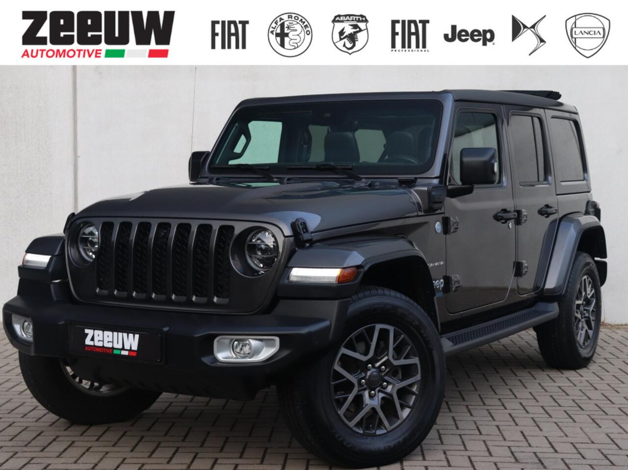 Jeep WRANGLER Unlimited 4xe 380 PK Sahara | Leder | Soft Top | Camera | 18"