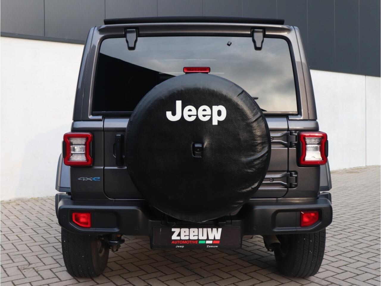 Jeep WRANGLER Unlimited 4xe 380 PK Sahara | Leder | Soft Top | Camera | 18"