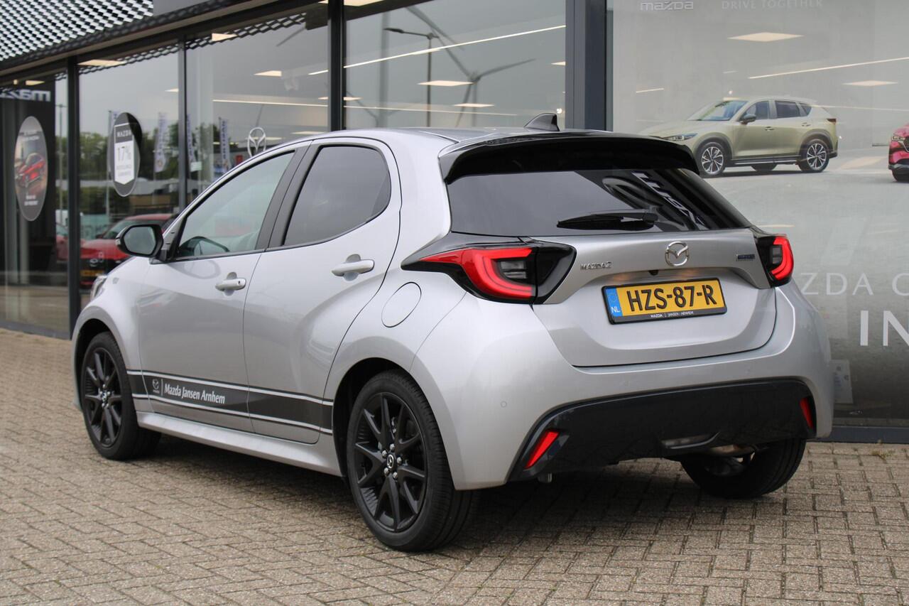 Mazda 2 Hybrid 1.5 Homura , Demovoordeel ¤ 3.000,-, Automaat, Apple Carplay, Clima, Adap.Cruise, LMV 17 Inch, Camera, PDC, Stuur/Stoelverwarming