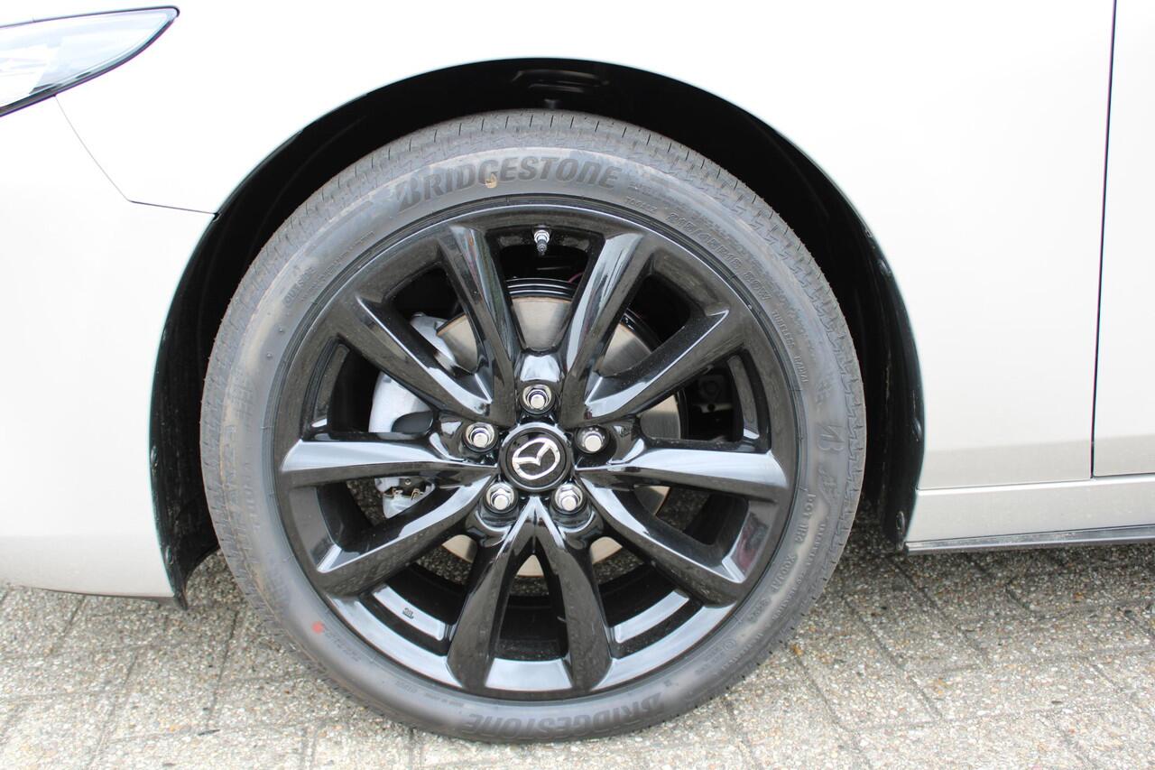 Mazda 3 2.0 e-SkyActiv-X M Hybrid 186 Nagisa Demovoordeel ¤ 5.000,-, Bruin Leder, Bose, Navi, Adap.Cruise, Clima, Apple Carplay, Camera, PDC, HUD, Stoelverwarming, 18" LMV